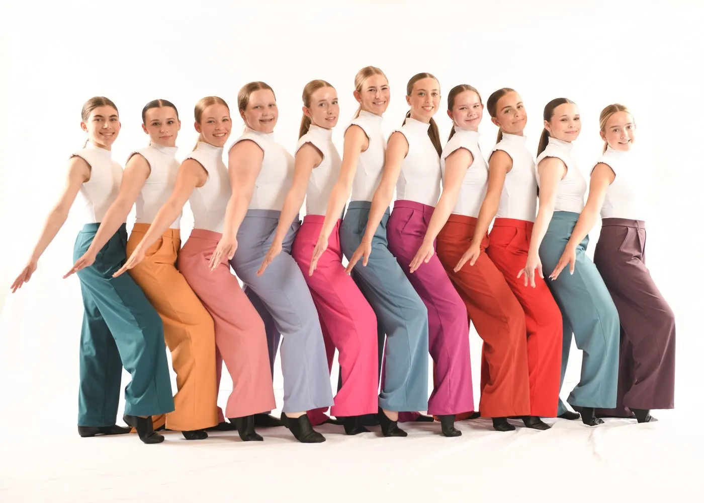 Dancers in colorful wide-leg pants